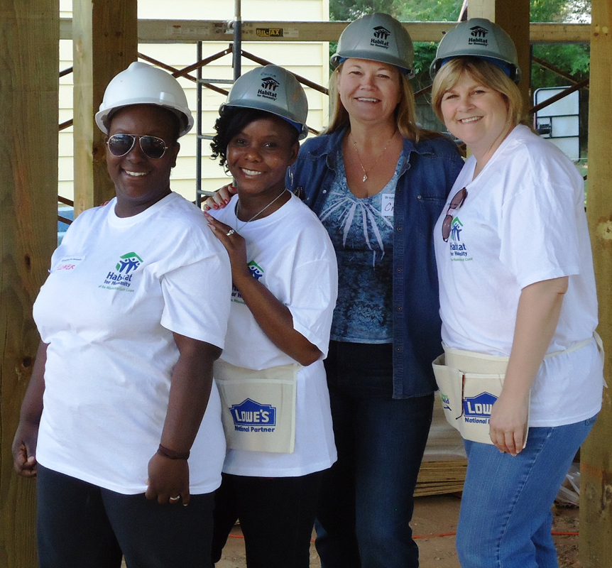 female workers smiling at camera