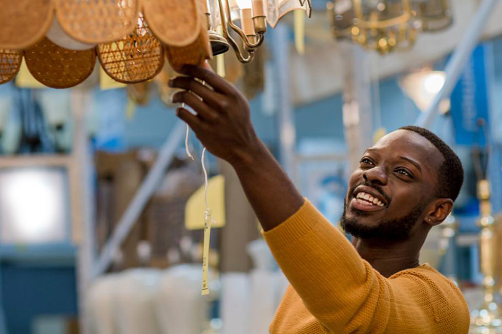 Restore man looking at light fixture
