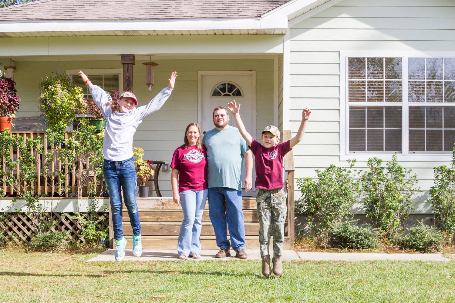 winstead-family-4894-b Happy family in front of home